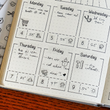 Load image into Gallery viewer, weekly planner layout with black transparent stickers
